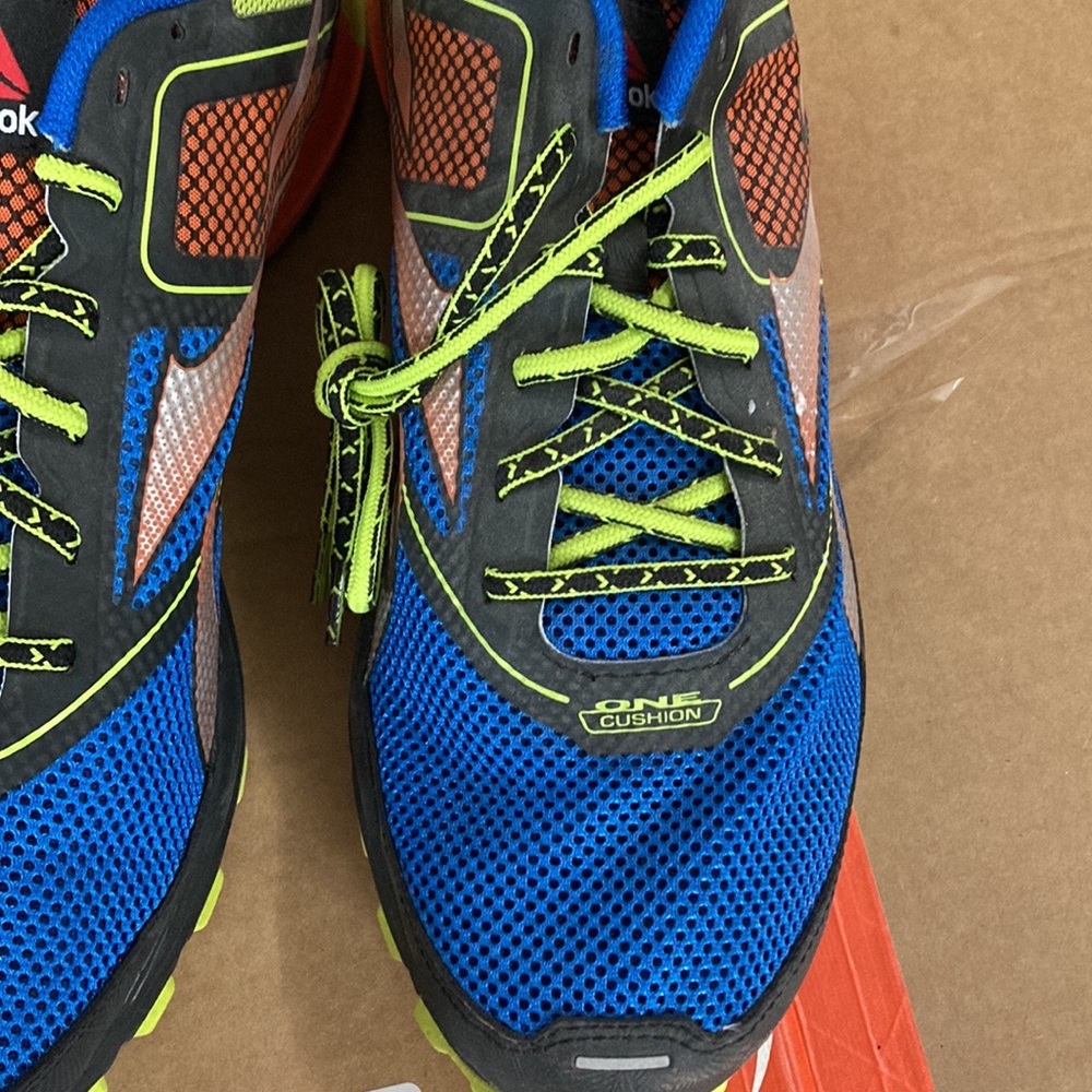 Multi colored reebok sneakers.  Never worn.  Size 12